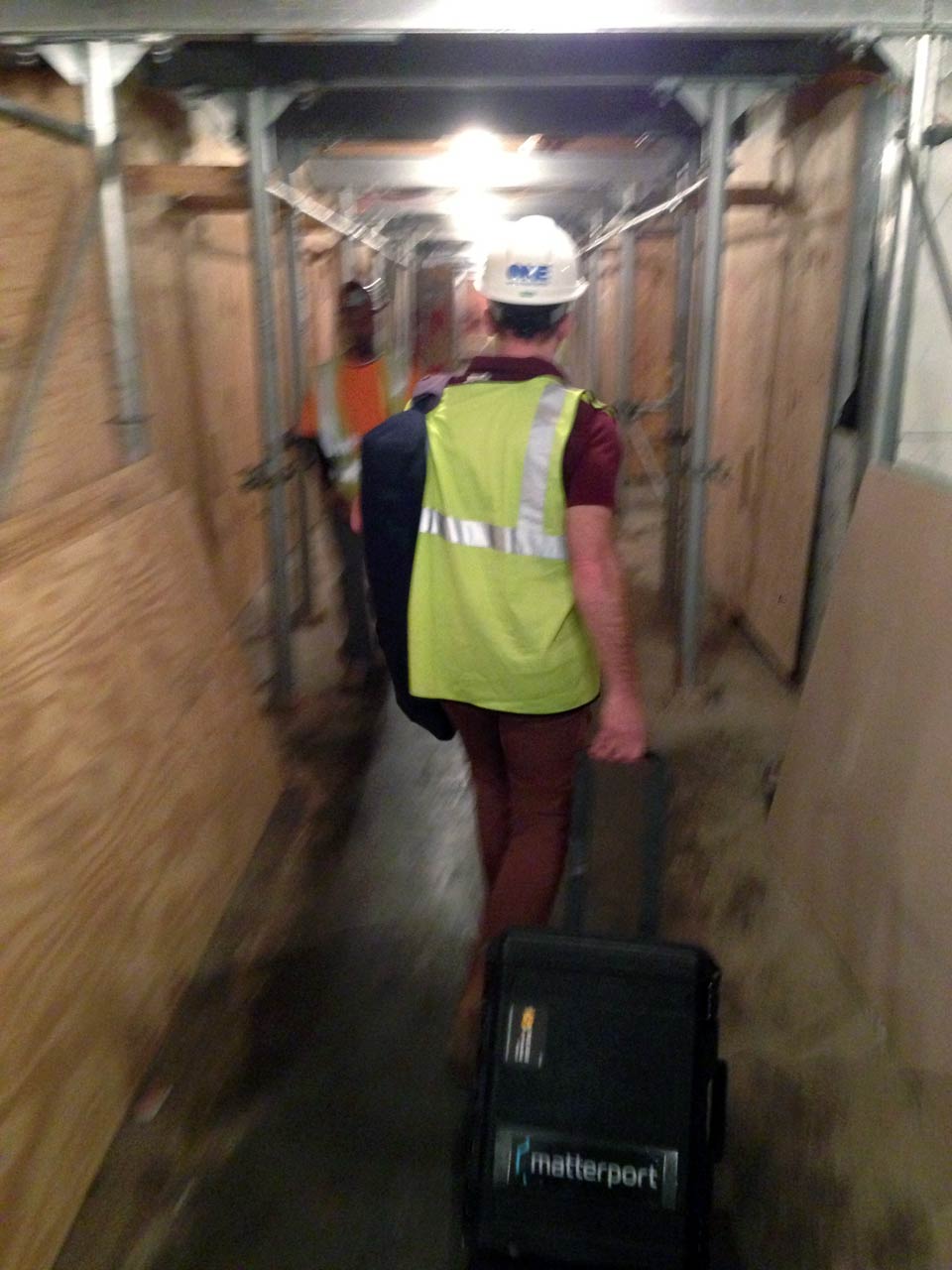 Dave wheels the Matterport camera down the skeleton of a hallway at One World Trade Center.